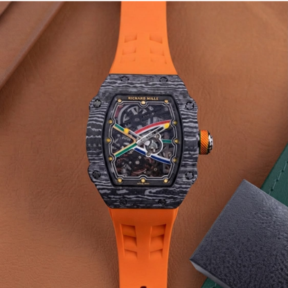 Men's luxury skeleton watch with black carbon fiber style case and red silicone strap.