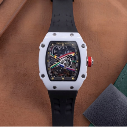 Men's luxury skeleton watch with white ceramic-style case and black silicone strap.