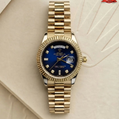 Rolex day-date gold watch featuring royal blue dial with diamond hour markers