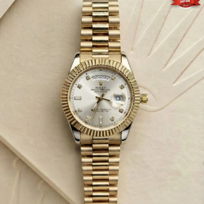 Rolex day-date gold watch with silver diamond dial and fluted bezel