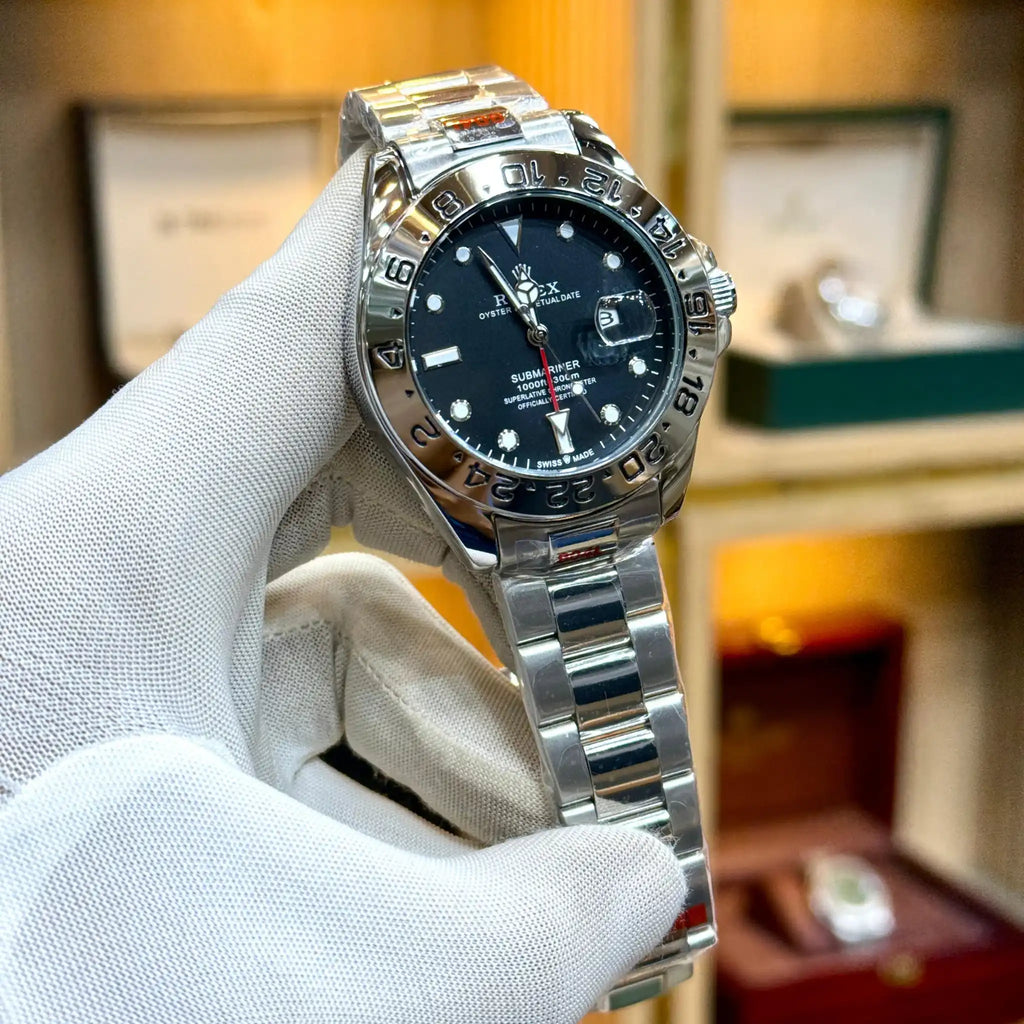 Rolex-style watch with a black dial and silver bracelet.