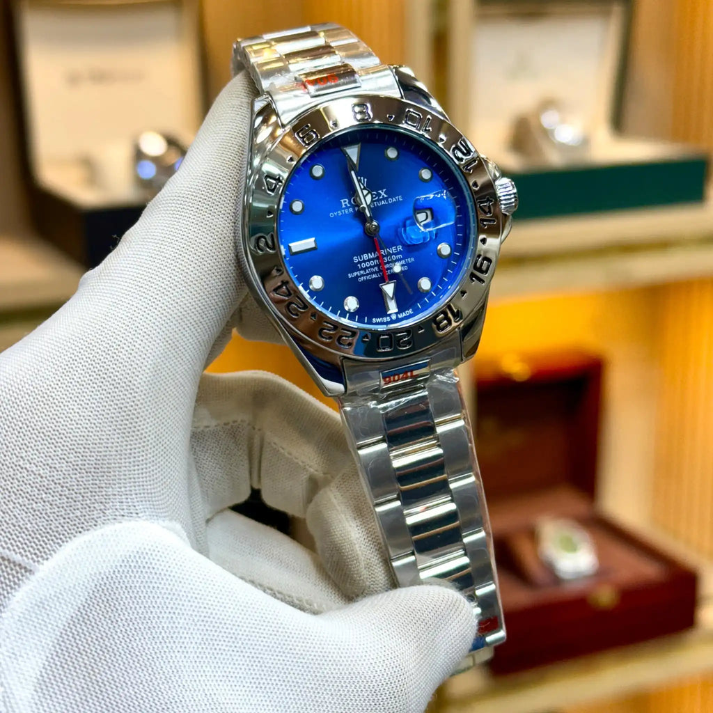 Rolex-style watch with a blue dial and silver bracelet.