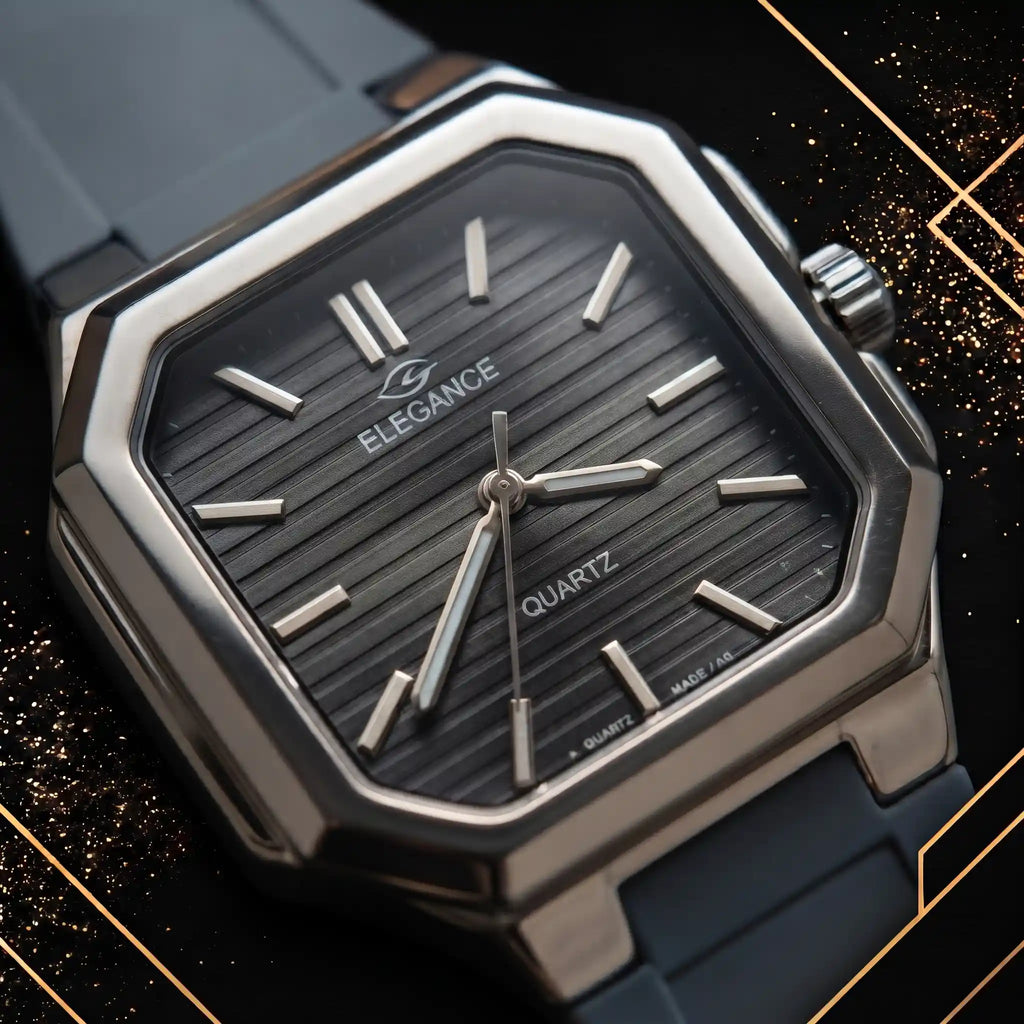 Macro closeup hero shot of the Elegance dark grey textured dial, silver hour markers, hands, and branded logo under sophisticated soft spotlighting.