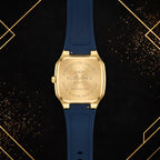 Rear view of the Elegance luxury watch showing the gold stainless steel case back and full navy strap.
