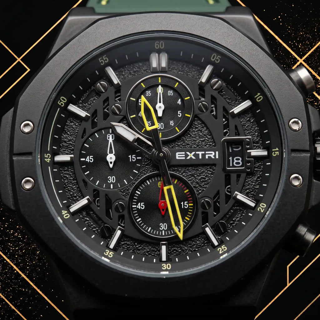 Macro close-up shot of the Extri men's watch dial displaying detailed chronograph subdials, date window, yellow hands, and textured black background.