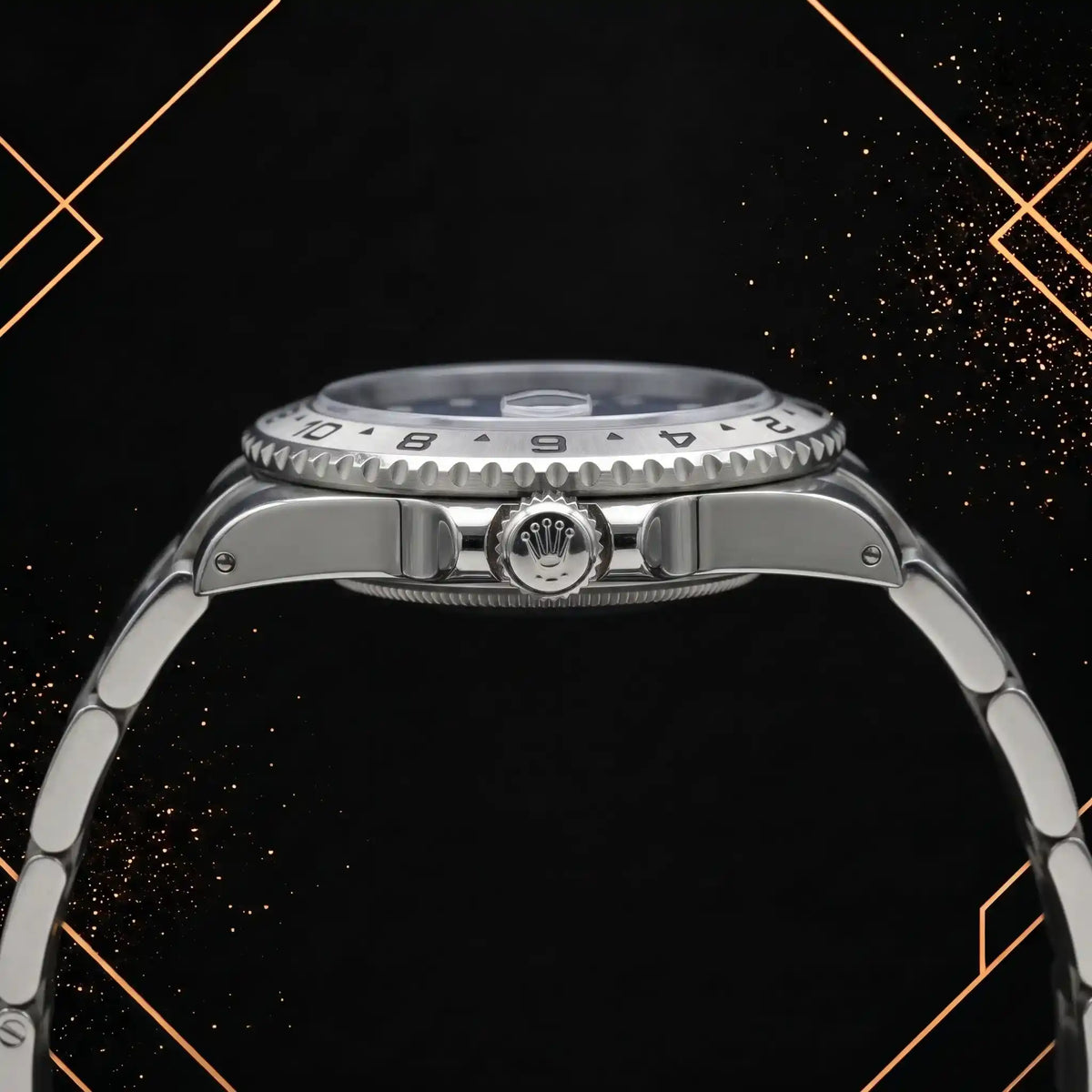 Horizontal side view of a steel wristwatch showing the knurled winding crown, case thickness, grooved bezel edge, and bracelet links.