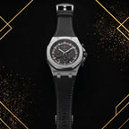 Sophisticated diagonal view of the XTRI luxury watch displayed on a textured black and gold abstract background with metallic gold geometric framing