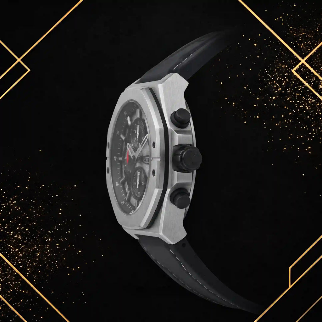 Side profile view of the XTRI luxury chronograph watch highlighting the brushed metallic silver case thickness, crown, chronograph pushers, and textured black rubber strap