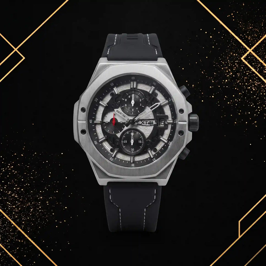 XTRI men's luxury chronograph watch featuring a silver and black skeleton dial, brushed octagonal stainless steel case, and black silicone strap with white contrast stitching