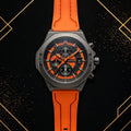 XTRI luxury men's chronograph watch with black and textured orange dial, gunmetal case, and orange silicone strap - front view