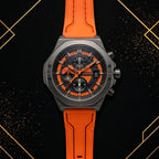 XTRI luxury men's chronograph watch with black and textured orange dial, gunmetal case, and orange silicone strap - front view