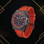 45-degree angle view of XTRI luxury men's chronograph watch highlighting case contours, dial depth, and red strap on an elegant black and gold background.